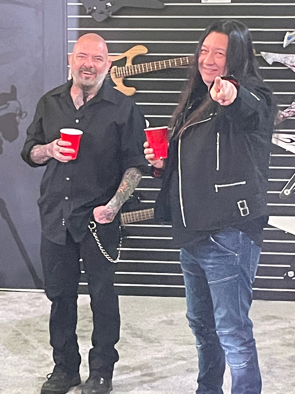 Dean guitars' Chris Cannella and Testament guitarist Eric Peterson enjoy some herbal tea in their red Solo cups.