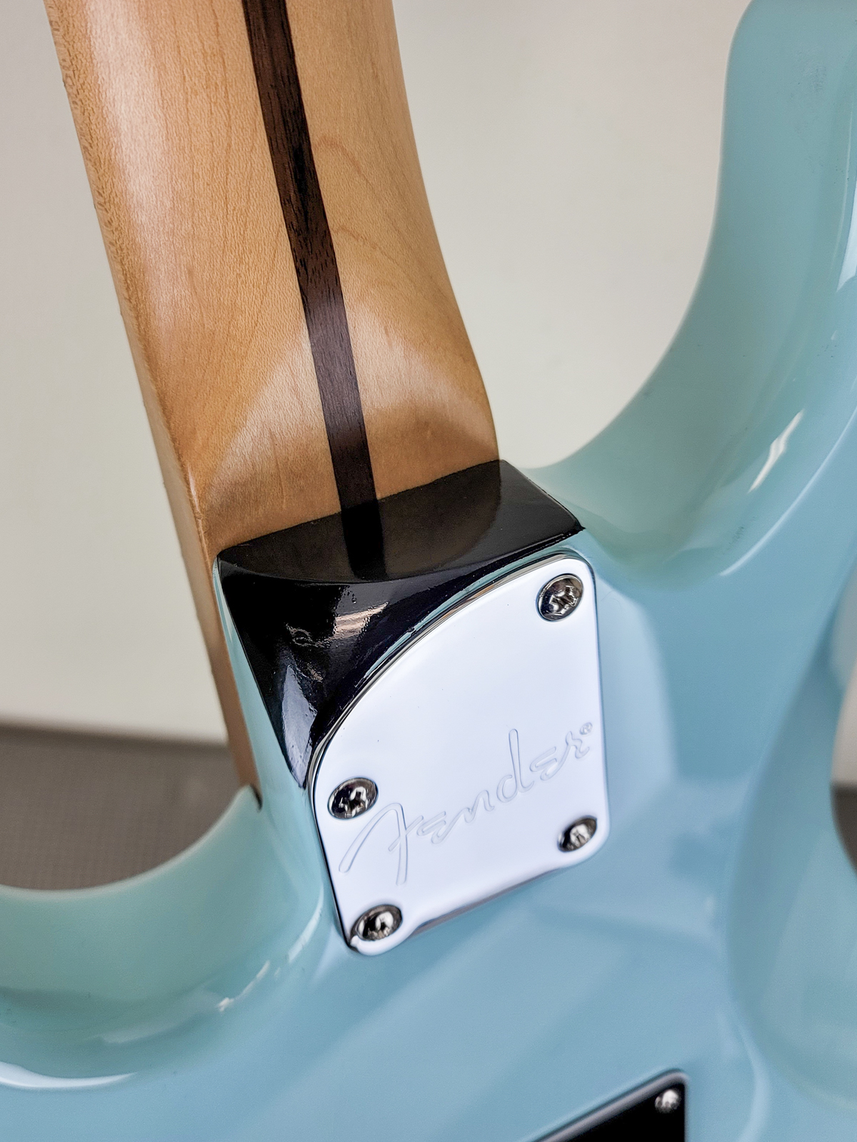 There is an aftermarket neck carve on the neck heel.