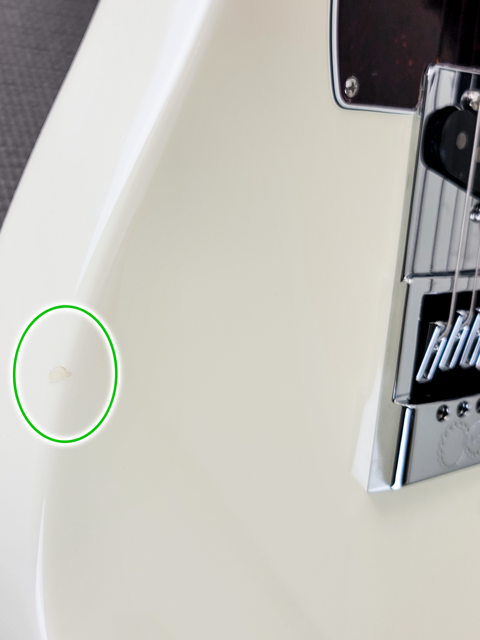 There is a small chip on the bass side lower bout. The chip has been repaired, and does not affect playability.