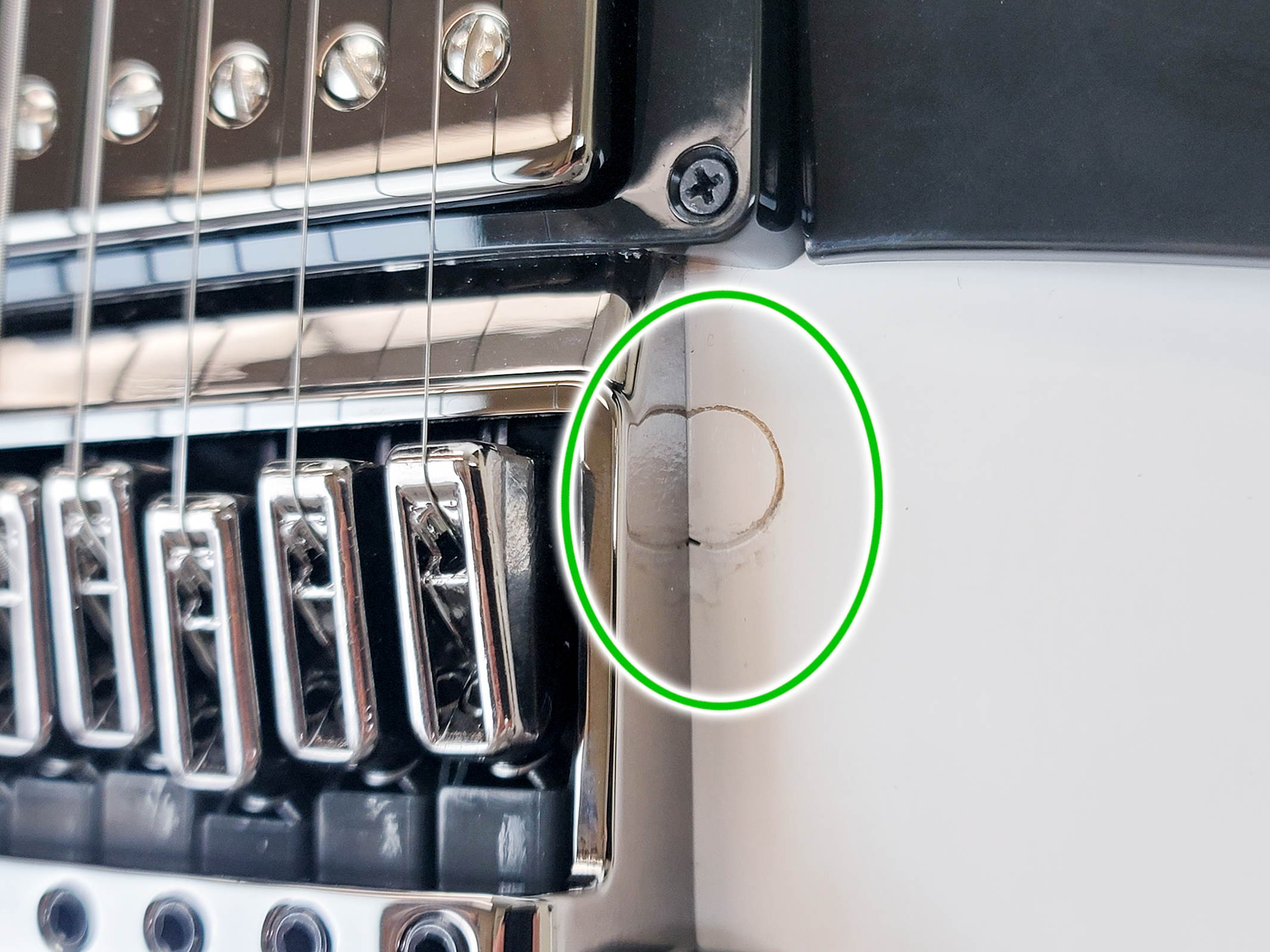 There is a small chip on the treble side plug. The chip has been repaired, and does not affect playability.