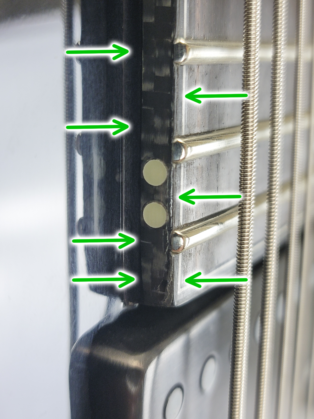 There is a binding blemish on the bass side where the neck connects to the body.